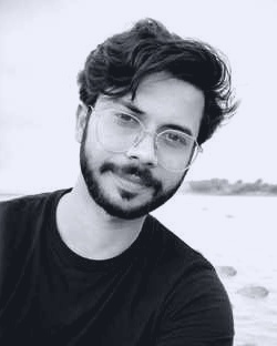 Portrait of Adnan Murad, black-and-white photo by the sea